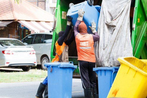 Community members participating in temple cleanliness drive